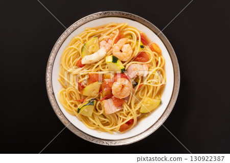 Spaghetti with zucchini and shrimp in tomato soup Spaghetti with zucchini and shrimp in tomato soup 130922387