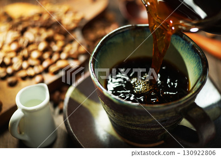 Hot coffee/Coffee poured into a coffee cup Hot coffee/Coffee poured into a coffee cup 130922806
