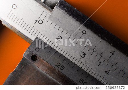 Close-up of a caliper on a bright background. Vintage measuring instruments 130922872
