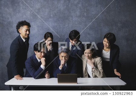People looking at computers People looking at computers 130922963