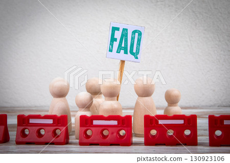 Wooden figures with FAQ sign and red barriers concept 130923106