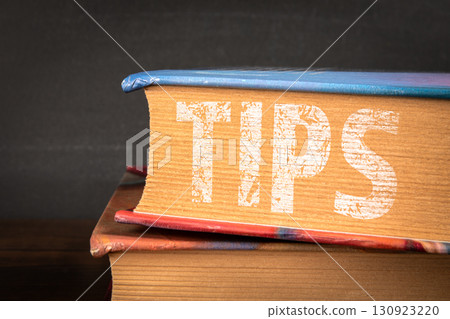 Close up of book spine with tips text Close up of book spine with tips text 130923220