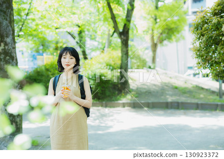 A woman walking in green 130923372