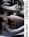 The suspension of a four-wheel drive pickup truck that has been used for rough use 130923621