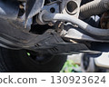 The suspension of a four-wheel drive pickup truck that has been used for rough use 130923624