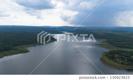 Drone shot. Aerial view scenic landscape of a large river delta amid a lush forest at the tropical Asia place 130923625