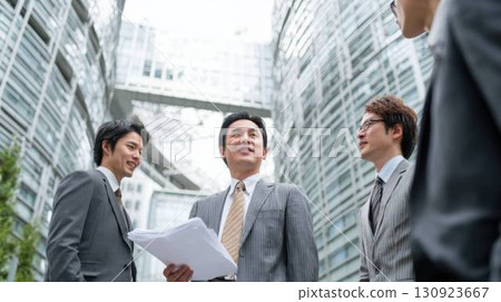 Business team chatting in an office district 130923667