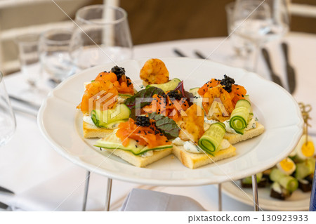 plate of shrimp canapes and wine glasses plate of shrimp canapes and wine glasses 130923933