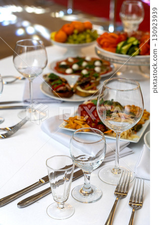 A beautifully arranged plate of assorted bruschetta, canapes, and marinated appetizers 130923939