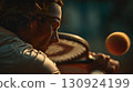 Focused Strike: Tennis Player in Action 130924199