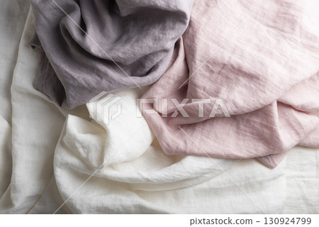 Sewing concept with pink, lilac and white linen fabric Sewing concept with pink, lilac and white linen fabric 130924799