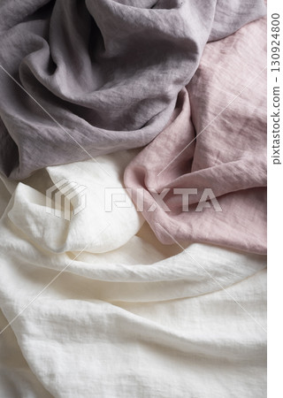 Sewing concept with pink, lilac and white linen fabric Sewing concept with pink, lilac and white linen fabric 130924800