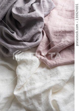 Sewing concept with pink, lilac and white linen fabric Sewing concept with pink, lilac and white linen fabric 130924801