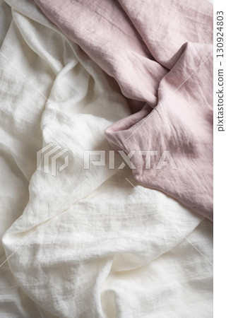 Sewing concept with pink and white linen fabric Sewing concept with pink and white linen fabric 130924803