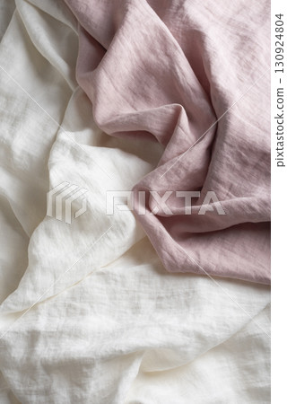 Sewing concept with pink and white linen fabric Sewing concept with pink and white linen fabric 130924804