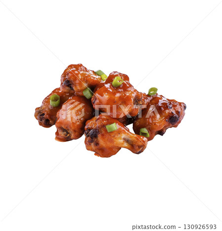 A Spicy buffalo chicken wings glazed with tangy sauce and garnished with chopped green onions, perfect for flavorful appetizer or party snack 130926593