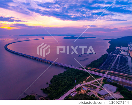 Amazing aerial view of the Penang Bridge in sunset or sunrise sky background 130927344