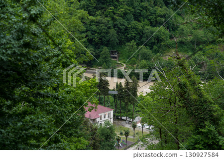 A cable car in the mountains of Georgia. View of the city from a height A cable car in the mountains of Georgia. View of the city from a height 130927584