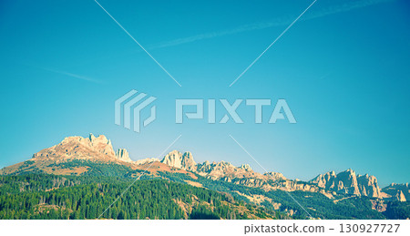 Mountain landscape with clear blue sky on a sunny day. Mountains of the Dolomites. Thought Tyrol, Italy Europe. Horizontal banner Mountain landscape with clear blue sky on a sunny day. Mountains of the Dolomites. Thought Tyrol, Italy Europe. Horizontal banner 130927727