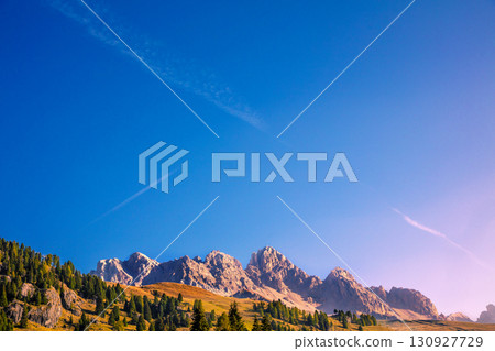 Mountain landscape with clear blue sky on a sunny day. Mountains of the Dolomites. Thought Tyrol, Italy Europe. Horizontal banner Mountain landscape with clear blue sky on a sunny day. Mountains of the Dolomites. Thought Tyrol, Italy Europe. Horizontal banner 130927729