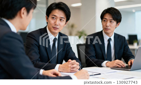 A businessman with a serious expression attending a meeting A businessman with a serious expression attending a meeting 130927743