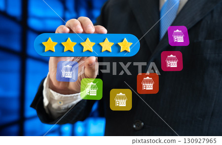 A man gives a five-star rating to a store or franchise. Recognition of popularity and good reviews. Customer satisfaction, brand reputation, online business success. 130927965