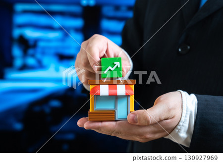 The businessman notes the profitability of the business. Symbol of financial growth, positive balance and stable income. Useful for reports, investments, strategic planning and corporate success. 130927969