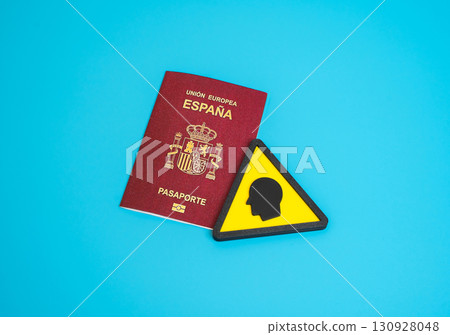 Spanish passport and human symbol. Identity card. Obtaining citizenship. Biometric data. Concept of migration, travel and global mobility. Useful for law, security, border control and society. 130928048