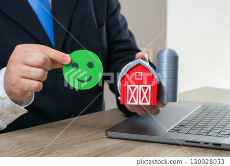 The investor approves the issuance of a loan for the purchase of a farm. Investments and subsidies to support and develop farming. Symbol of food security, agribusiness, loans and sustainability. 130928053