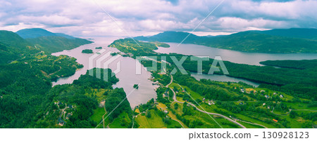 Panoramic view from above of the mountain valley with Holmefjord at sunset. Norway Europe. Horizontal banner Panoramic view from above of the mountain valley with Holmefjord at sunset. Norway Europe. Horizontal banner 130928123