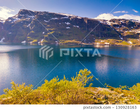 Panoramic view of the high mountain lake with dam. Lake Svartavatnet in the mountains in summer. Natural park in the municipality of Sauda. The beautiful nature of Norway 130928163