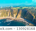 View from above of rocky seascape. Beautiful bay in Ensenada de San Pedro, view of Playa de San Pedro de La Ribera, Cudillero, Asturias, Spain 130928168