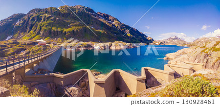 Panoramic view of the high mountain lake with dam. Lake Svartavatnet in the mountains in summer. Staudamm. Natural park in the municipality of Sauda. The beautiful nature of Norway. Horizontal banner 130928461