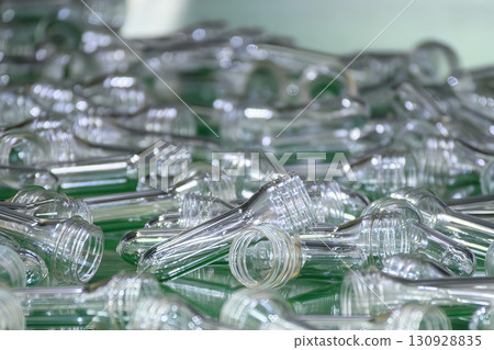 Close up scene of group of preform shape of PET bottle products. 130928835