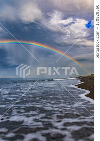 A rainbow appears on the Okhotsk coast after the rain 130929560