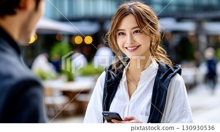 Smiling woman portrait with image of meeting 130930536