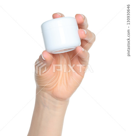 Woman hand holds a white cosmetic cream jar, on transparent background close-up, template for cosmetics ads Woman hand holds a white cosmetic cream jar, on transparent background close-up, template for cosmetics ads 130930646