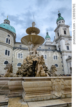Residenzbrunnen fountain and Salzburg Cathedral (Salzburger Dom) Roman Catholic Baroque cathedral in Salzburg, Austria 130930701