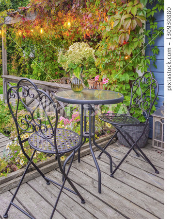 Inviting leafy patio dining space. Inviting leafy patio dining space. 130930880
