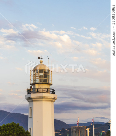 Shot of the lighthouse with mountains on the background Shot of the lighthouse with mountains on the background 130930962