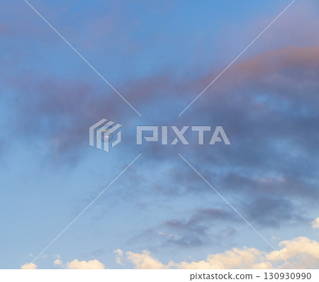 Soap bubble floats outdoors, blue sky and clouds on the background Soap bubble floats outdoors, blue sky and clouds on the background 130930990