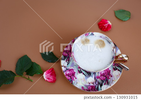 Delicate porcelain cup with foam and petals expressing love for dear mom 130931015