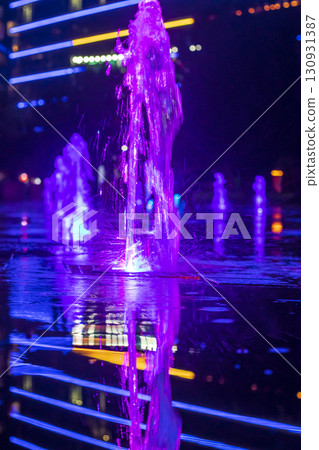Colorful Illuminated fountains in the dark in the park 130931387