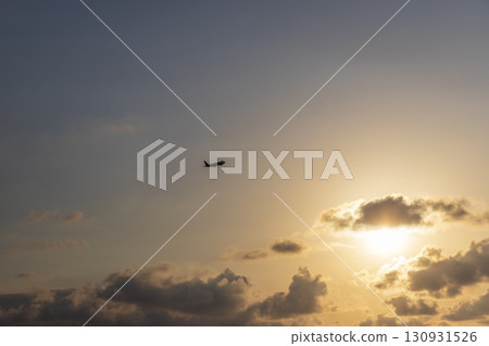 Airplane that just took of to the beautiful sunset sky Airplane that just took of to the beautiful sunset sky 130931526
