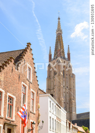 Tower of the Church of Our Lady Roman Catholic gothic church in Bruges, Belgium 130931695