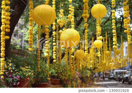 Hanging garlands of yellow marigolds and paper lanterns decorate the city streets. Diwali, the festival of lights. Hanging garlands of yellow marigolds and paper lanterns decorate the city streets. Diwali, the festival of lights. 130931928