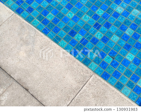Modern pool design featuring checkerboard tiles and smooth concrete deck. Modern pool design featuring checkerboard tiles and smooth concrete deck. 130931983