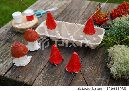 Sustainable autumn craft using natural and reused supplies, shaped like a mushroom. 130931988
