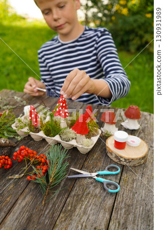 Autumn-inspired craft from natural and waste materials, depicting a mushroom. 130931989