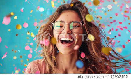 Celebrate joy and laughter with this captivating image of a woman enjoying a moment 130932152